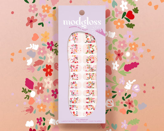 a package of floral nail stickers on a pink background